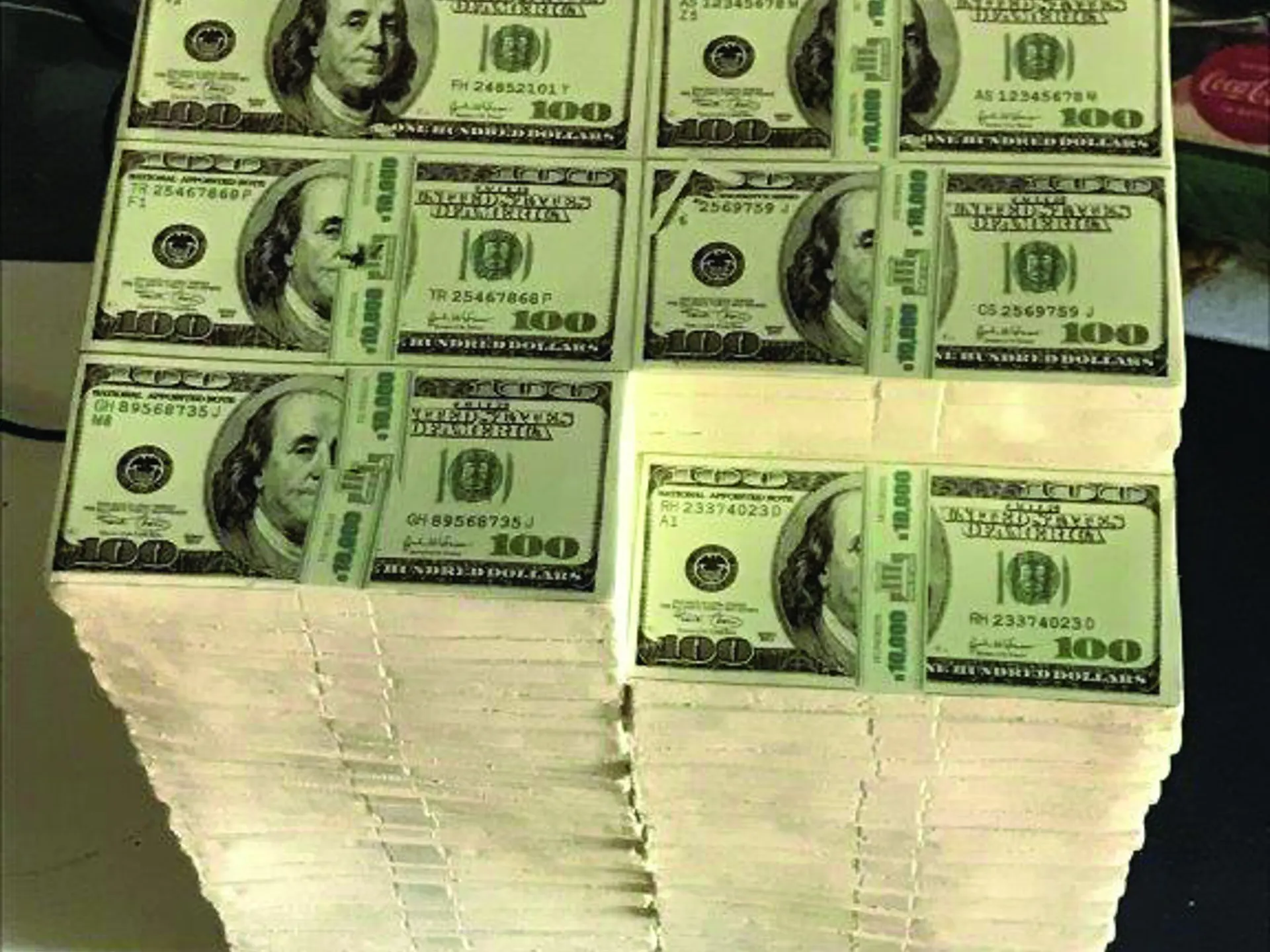 A decorative stack of $100 bills. | Fort Lauderdale 2017 | RM Sotheby's