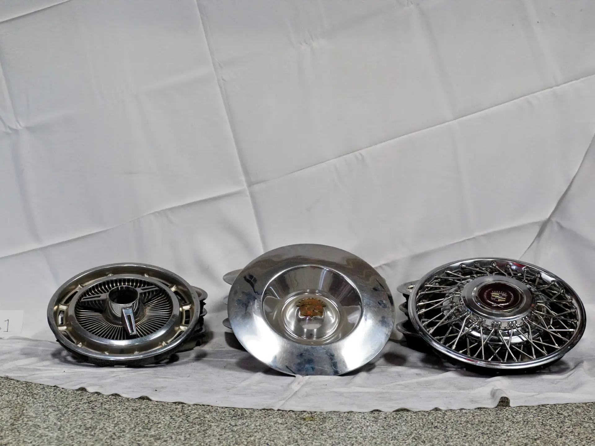 Three sets of Hubcaps Fort Lauderdale 2014 RM Sotheby's