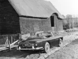 The Aston Martin is pictured under the ownership of Mr. P Stroud in the early 1970s, sporting the rather fitting registration “DB 4”.